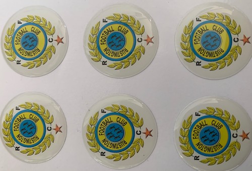 Domed medal stickers on football trophies